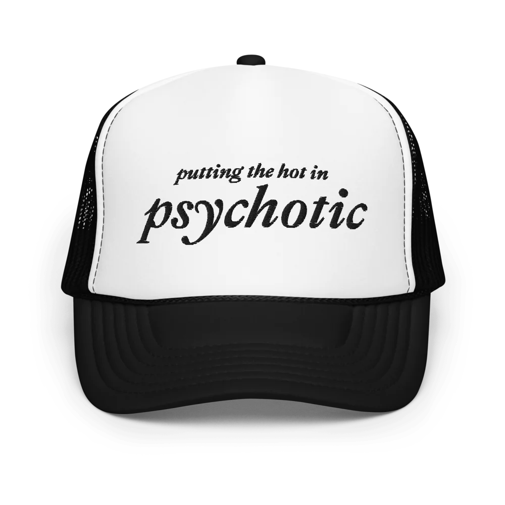 Black and white trucker hat with embroidered black text that says "putting the hot in psychotic"