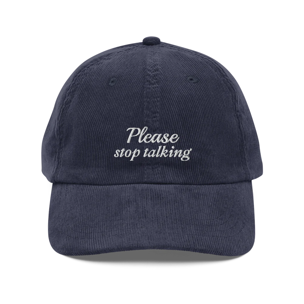 Dark Blue corduroy baseball hat with "Please stop talking" embroidered in white.