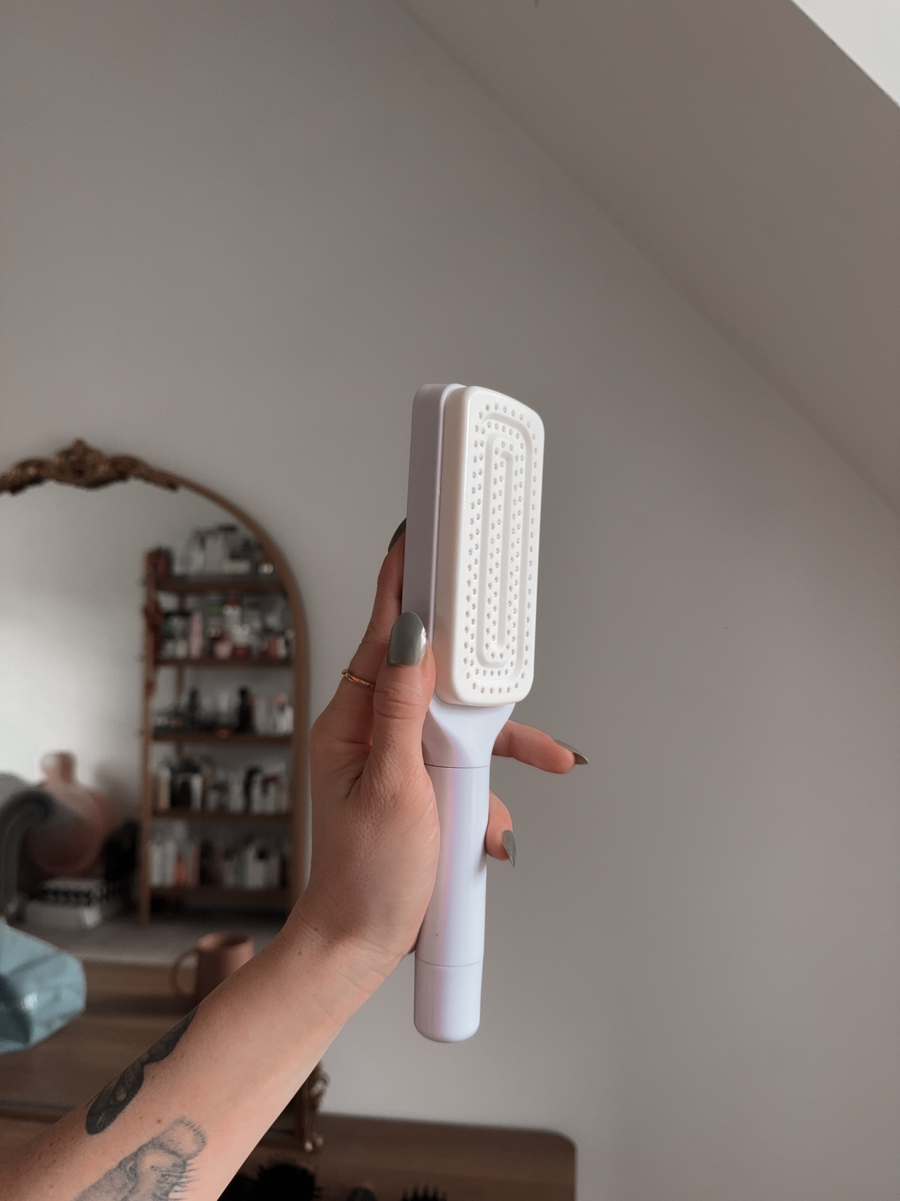 self cleaning hairbrush with the bristles twisted in