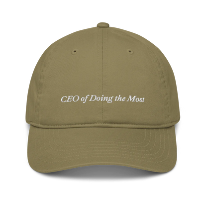 Green baseball hat with 'CEO of Doing the Most' text embroidered in white on a white background