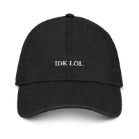 black denim baseball hat with 'IDK LOL' text embroidered in white on a white background
