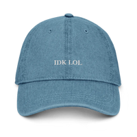 denim baseball hat with 'IDK LOL' text embroidered in white on a white background