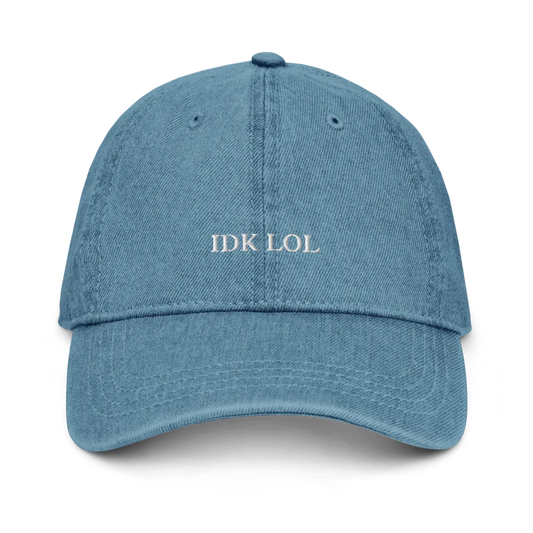 denim baseball hat with 'IDK LOL' text embroidered in white on a white background