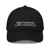 Black cap with 'High Standards Low Patience' text embroidered in white on a white background
