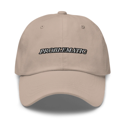 beige baseball hat with 'PROBLEMATIC' text embroidered on a white background
