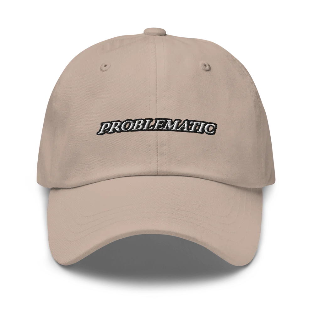 beige baseball hat with 'PROBLEMATIC' text embroidered on a white background