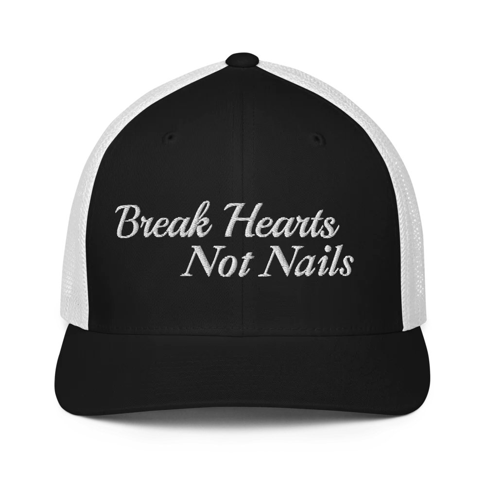 Black and white trucker hat with 'Break Hearts Not Nails' text embroidered in white on a white background