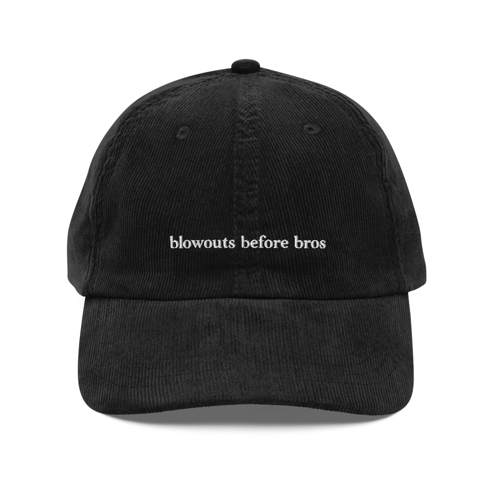 Black corduroy baseball hat with 'blowouts before bros' text embroidered in white on a white background