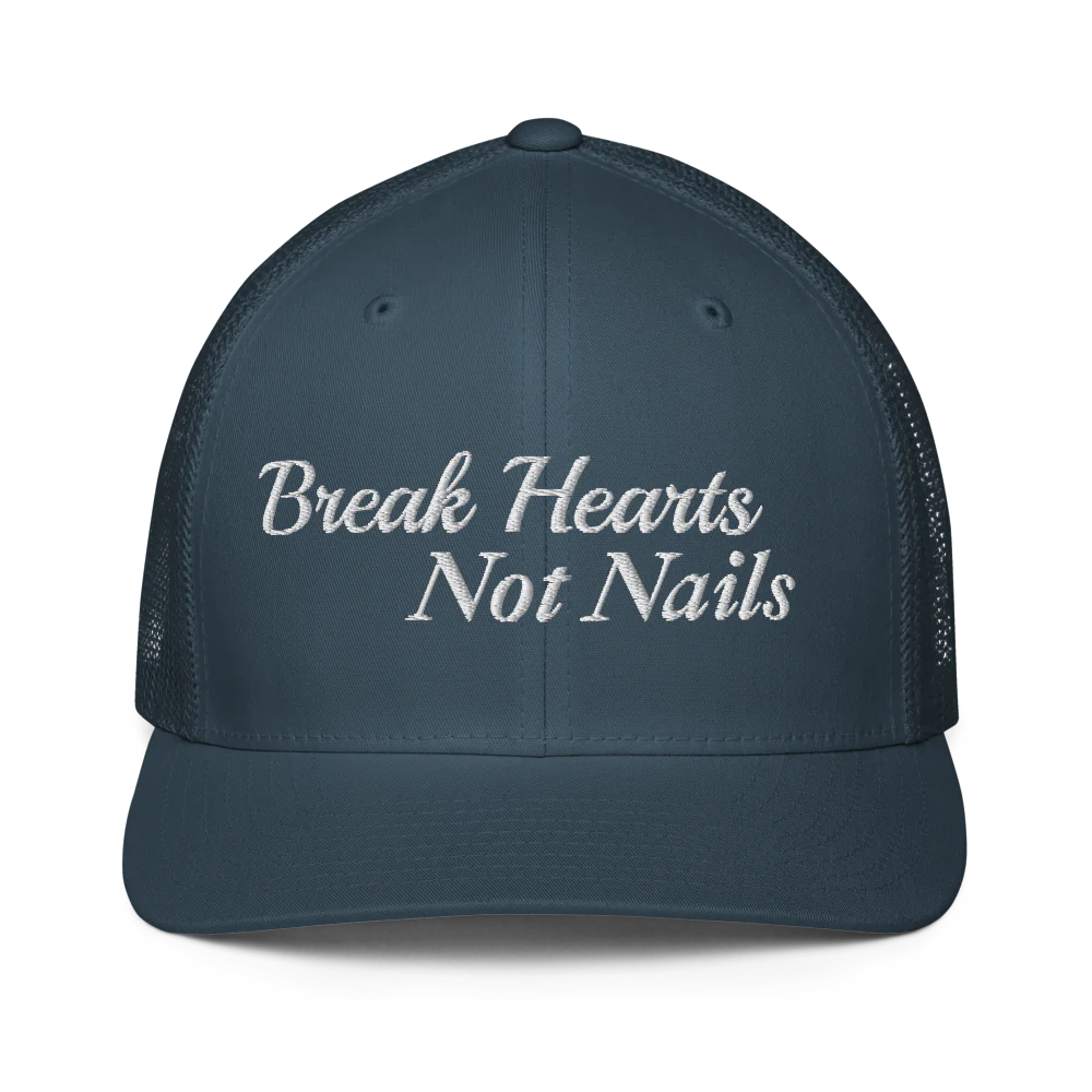 blue trucker hat with 'Break Hearts Not Nails' text embroidered in white on a white background