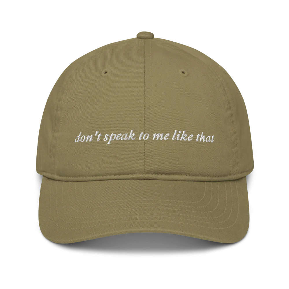 Green cap with 'don't speak to me like that' text embroidered