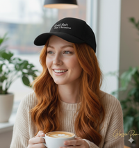 girl wearing black and white trucker hat with 'Good hair Bad Decisions' text embroidered in white