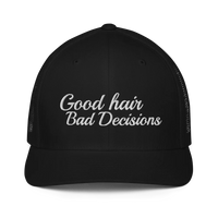 black trucker hat with 'Good hair Bad Decisions' text embroidered in white on a white background