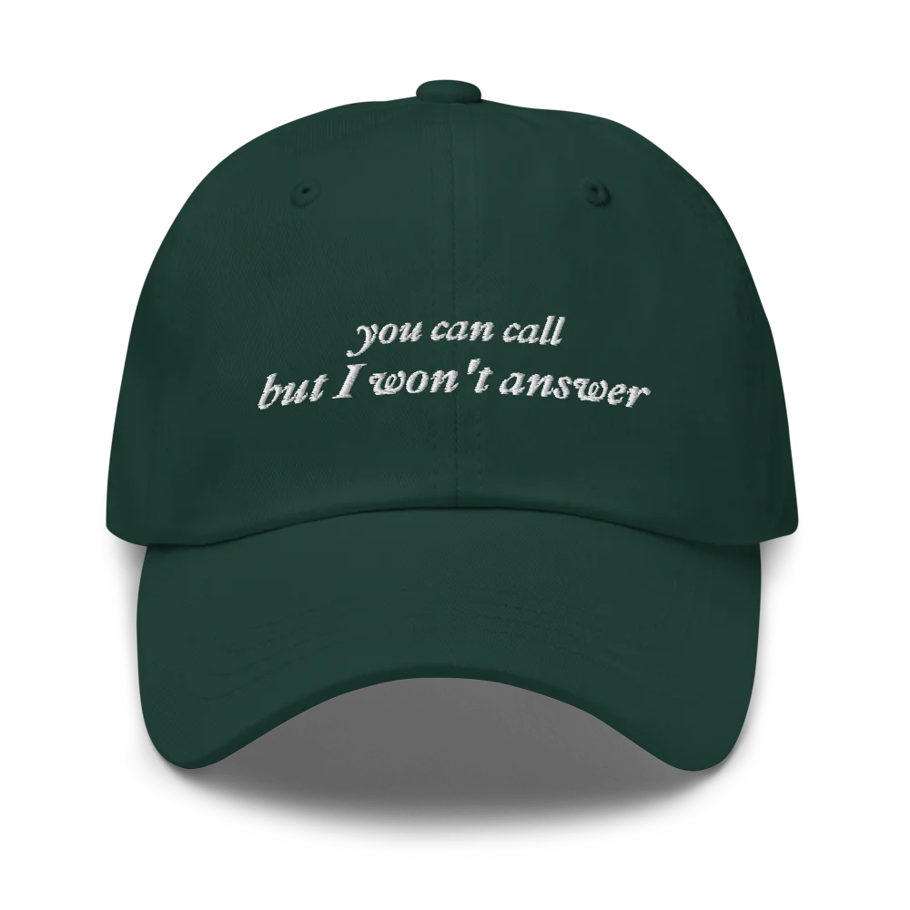 Dark Green baseball hat with white embroidered text 'you can call but I won't answer' on a white background