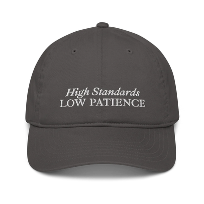 gray cap with 'High Standards Low Patience' text embroidered in white on a white background