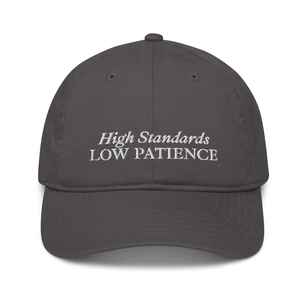 gray cap with 'High Standards Low Patience' text embroidered in white on a white background