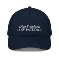 Navy Blue cap with 'High Standards Low Patience' text embroidered in white on a white background