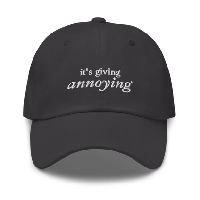Gray baseball hat with white text 'it's giving annoying' embroidered on front
