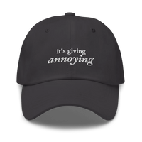 Gray baseball hat with white text 'it's giving annoying' embroidered on front