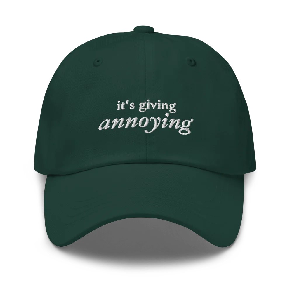 Green baseball hat with white text 'it's giving annoying' embroidered on front