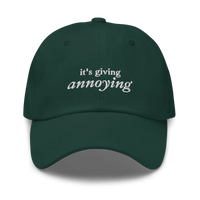 Green baseball hat with white text 'it's giving annoying' embroidered on front