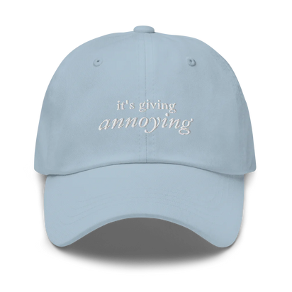 Light Blue baseball hat with white text 'it's giving annoying' embroidered on front