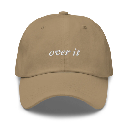 khaki baseball hat with 'over it' text embroidered in white on a white background