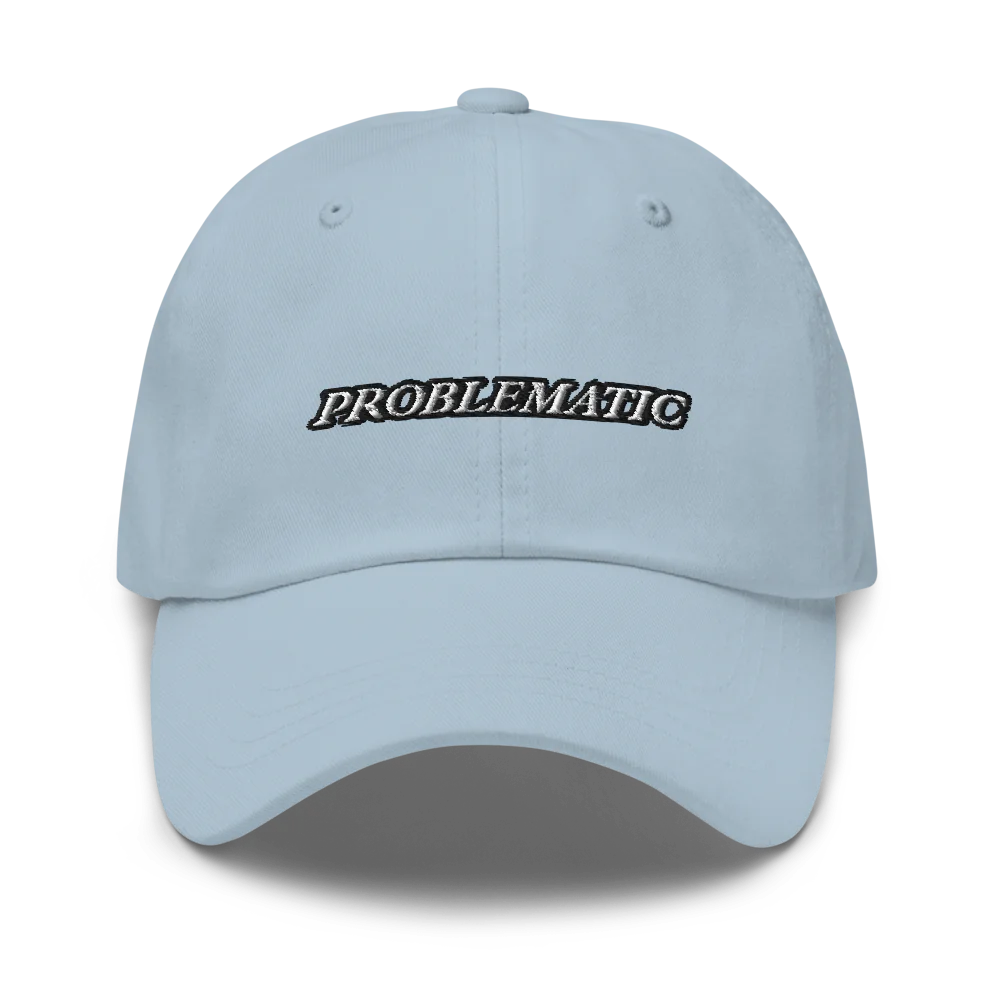 Light blue baseball hat with 'PROBLEMATIC' text embroidered on a white background
