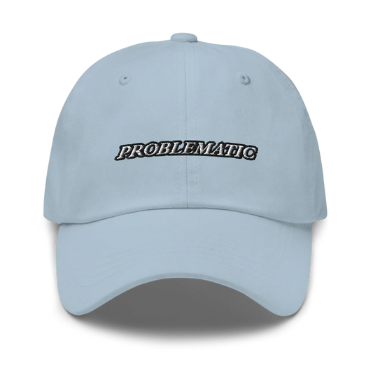 Light blue baseball hat with 'PROBLEMATIC' text embroidered on a white background