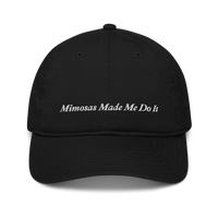 black baseball hat with 'Mimosas Made Me Do It' embroidered text on a white background
