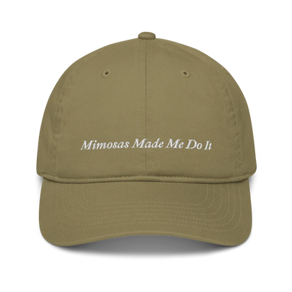 green baseball hat with 'Mimosas Made Me Do It' embroidered text on a white background