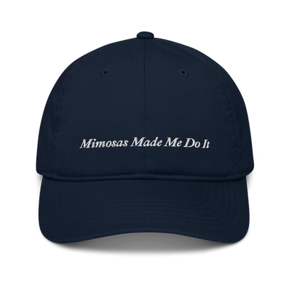 navy blue baseball hat with 'Mimosas Made Me Do It' embroidered text on a white background