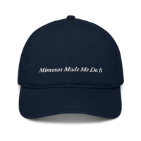 navy blue baseball hat with 'Mimosas Made Me Do It' embroidered text on a white background
