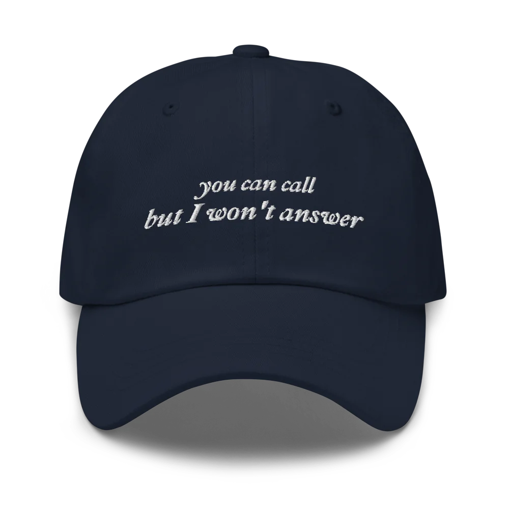Navy Blue baseball hat with white embroidered text 'you can call but I won't answer' on a white background
