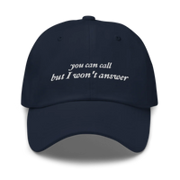 Navy Blue baseball hat with white embroidered text 'you can call but I won't answer' on a white background