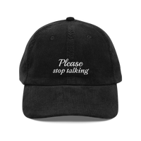 black corduroy baseball hat with "Please stop talking" embroidered in white.