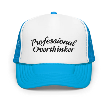 Blue and white trucker hat with 'Professional Overthinker' text on a white background