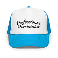 Blue and white trucker hat with 'Professional Overthinker' text on a white background