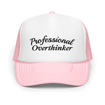 Pink and white trucker hat with 'Professional Overthinker' text on a white background