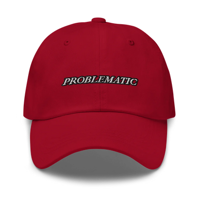 Red baseball hat with 'PROBLEMATIC' text embroidered on a white background