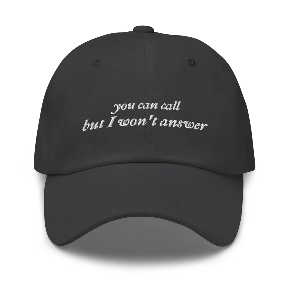 Gray baseball hat with white embroidered text 'you can call but I won't answer' on a white background